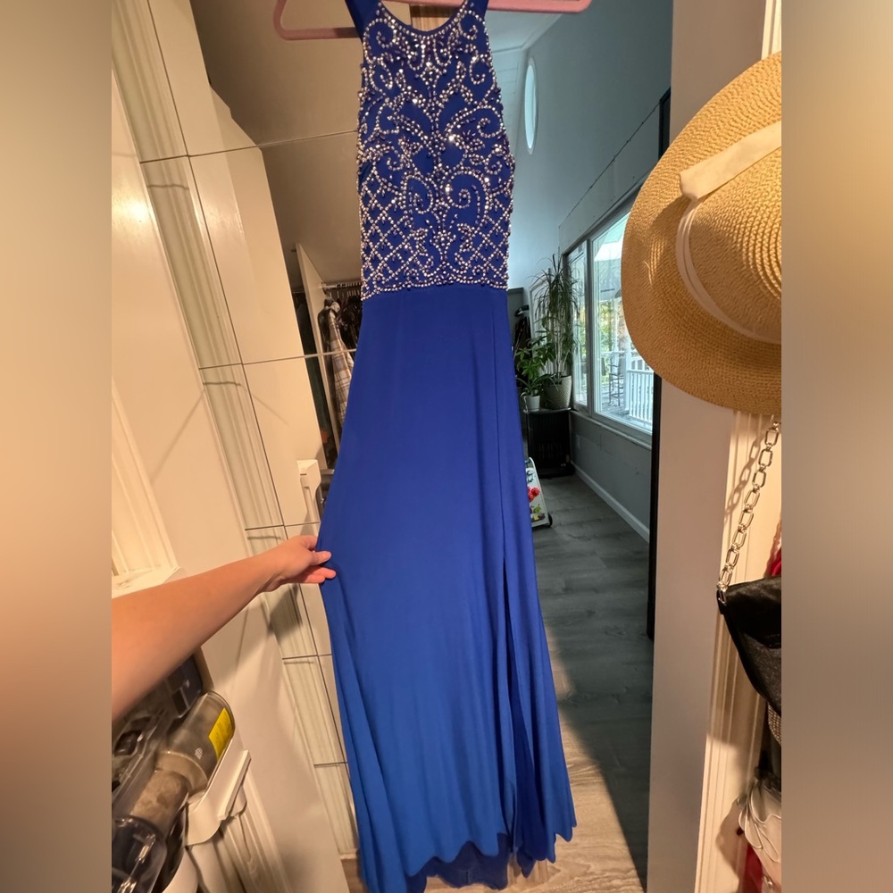 Blue long dress for a wedding guest.